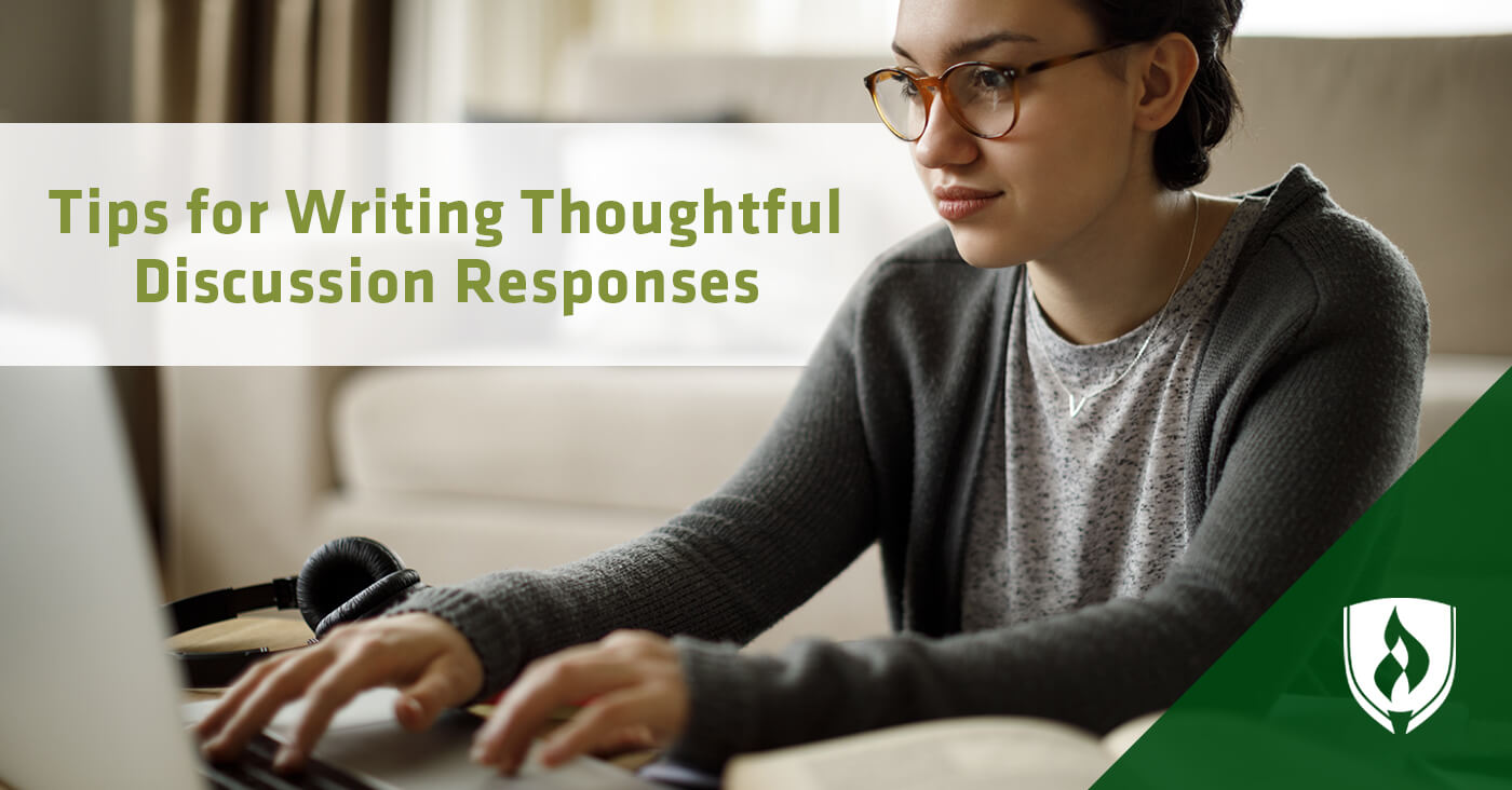 female student typing on laptop