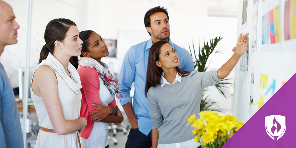 a photo of graphic design and marketing professionals working together