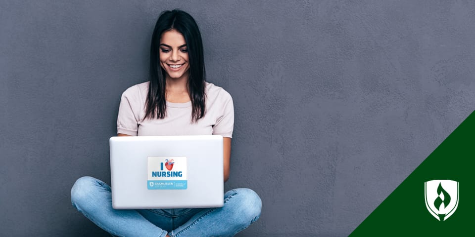 Woman sitting and working at laptop with 