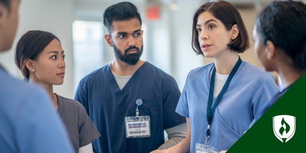 photo of charge nurse leaving a huddle representing what is a charge nurse