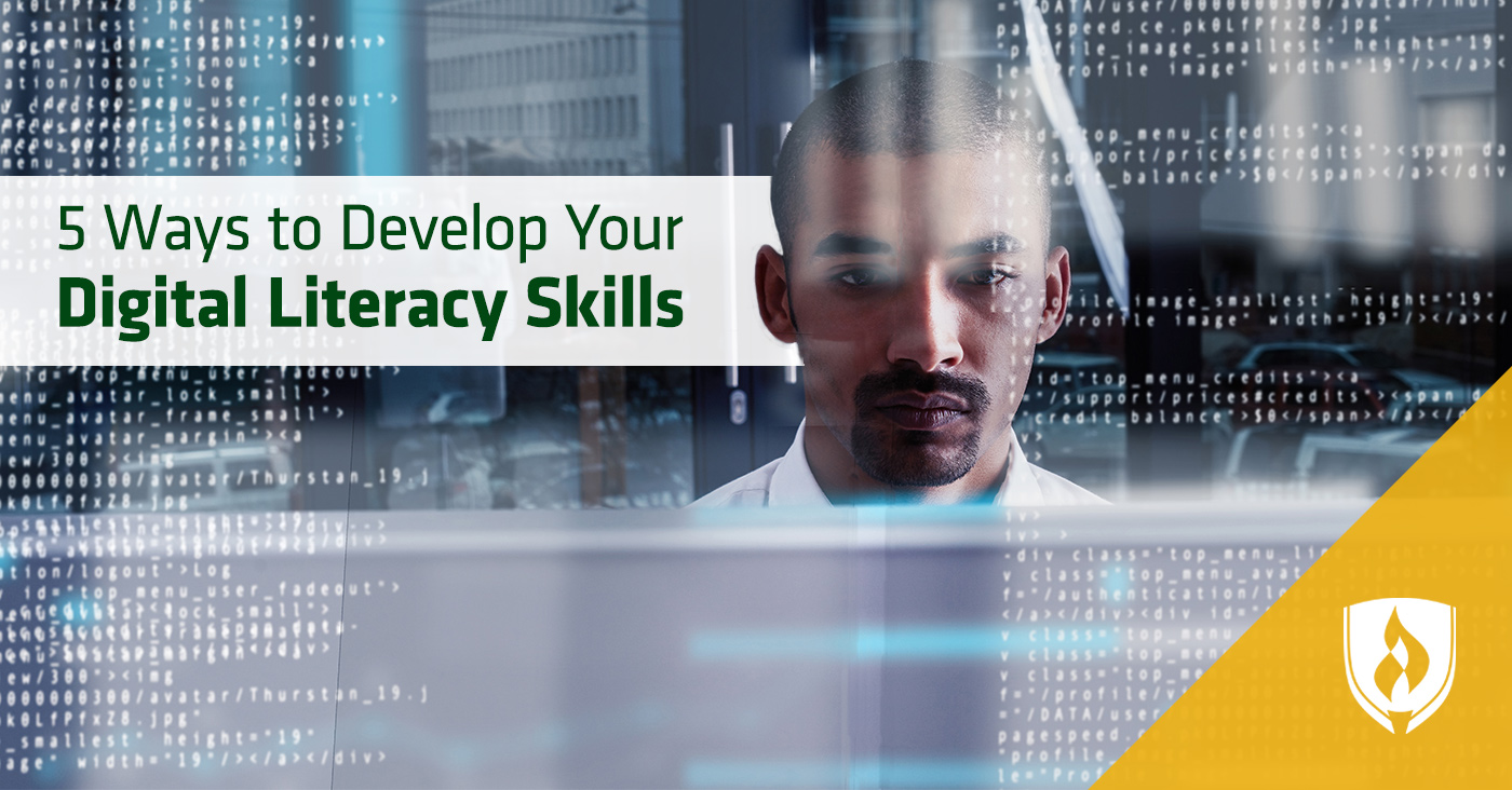 man sitting in front of computer looking at information on screen
